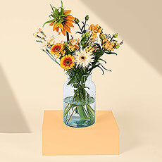 Surprise your favorite unique person with this eye-catching fresh bouquet in vibrant orange hues. Our in-house florists carefully arrange a striking array of orange blossoms in a loose modern bouquet. It's the ideal flower gift for someone with an eye for beautiful artistry.