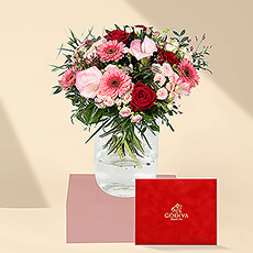 Spoil her with a stunning hand-created bouquet and lush Godiva chocolates in a gorgeous red velvet gift box. This is the perfect gift for her for romantic occasions, birthdays, and Mother's Day.
