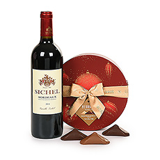 En cette période de fêtes, choisissez un cadeau de Noël qui réchauffe le cœur de vos proches. Une combinaison élégante de vin Sichel Bordeaux et d'un coffret cadeau spécial fin d'année Neuhaus avec des chocolats belges Irrésistibles.
