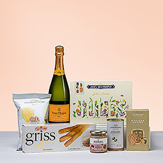 Celebrate summer with the lively taste of Veuve Clicquot Champagne! The iconic Champagne is paired with a beautiful Jules Destrooper gift box and savory gourmet snacks. It's a wonderful summer birthday gift. This lovely gift is also ideal for graduations, retirement, thank you, and hostess gifts.