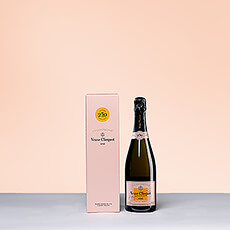 Champagne Veuve Cliquot Brut Rosé is a masterful creation of 50 to 60 different crus that is silky, lively, and bursting with red fruits like strawberries. Enjoy this full-bodied luminous Rosé with red fruits, tomatoes, seafood, or pastries. This beautiful Champagne gift is the epitome of elegance and style.
